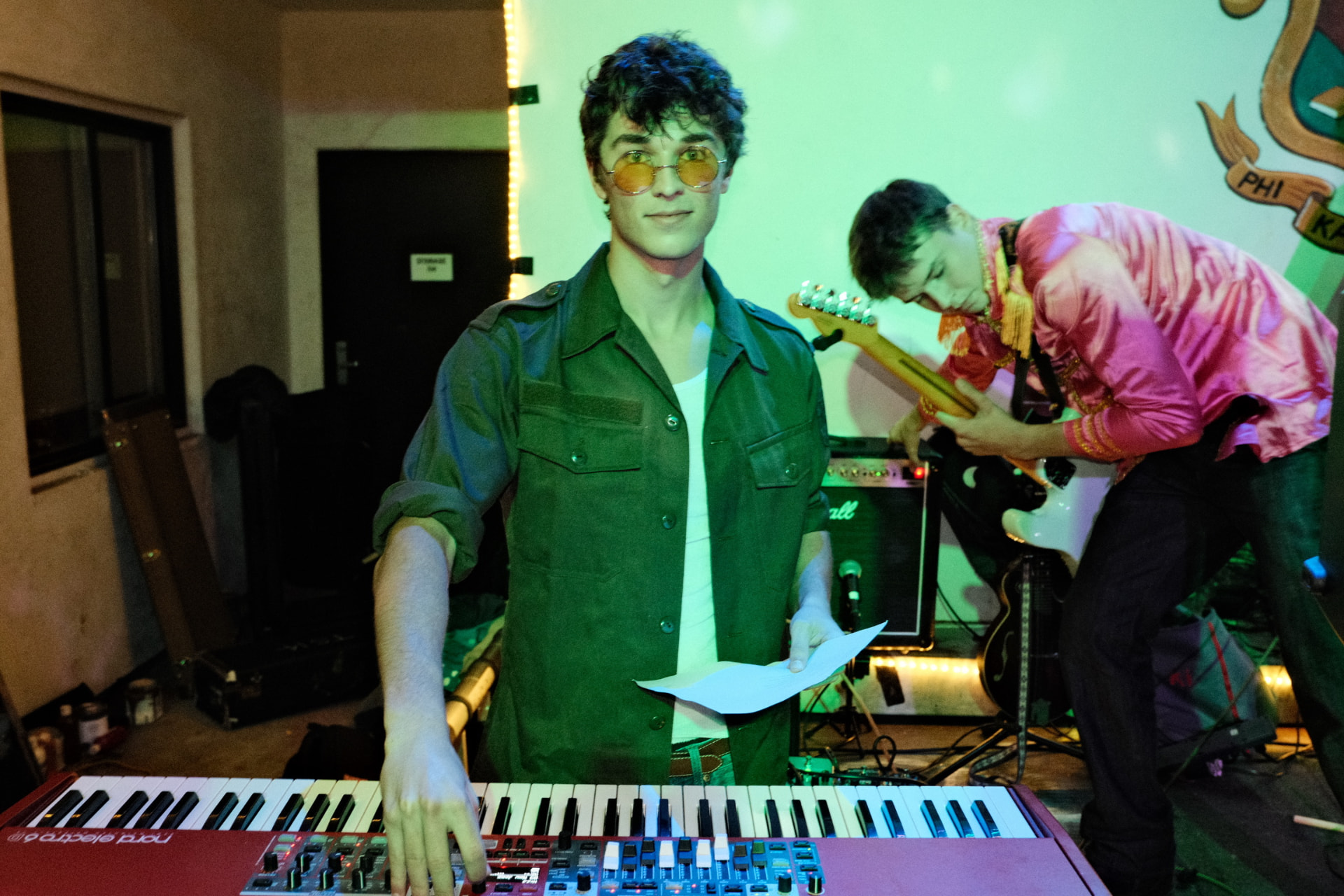 Keyboardist at a Nord piano during a fraternity house set