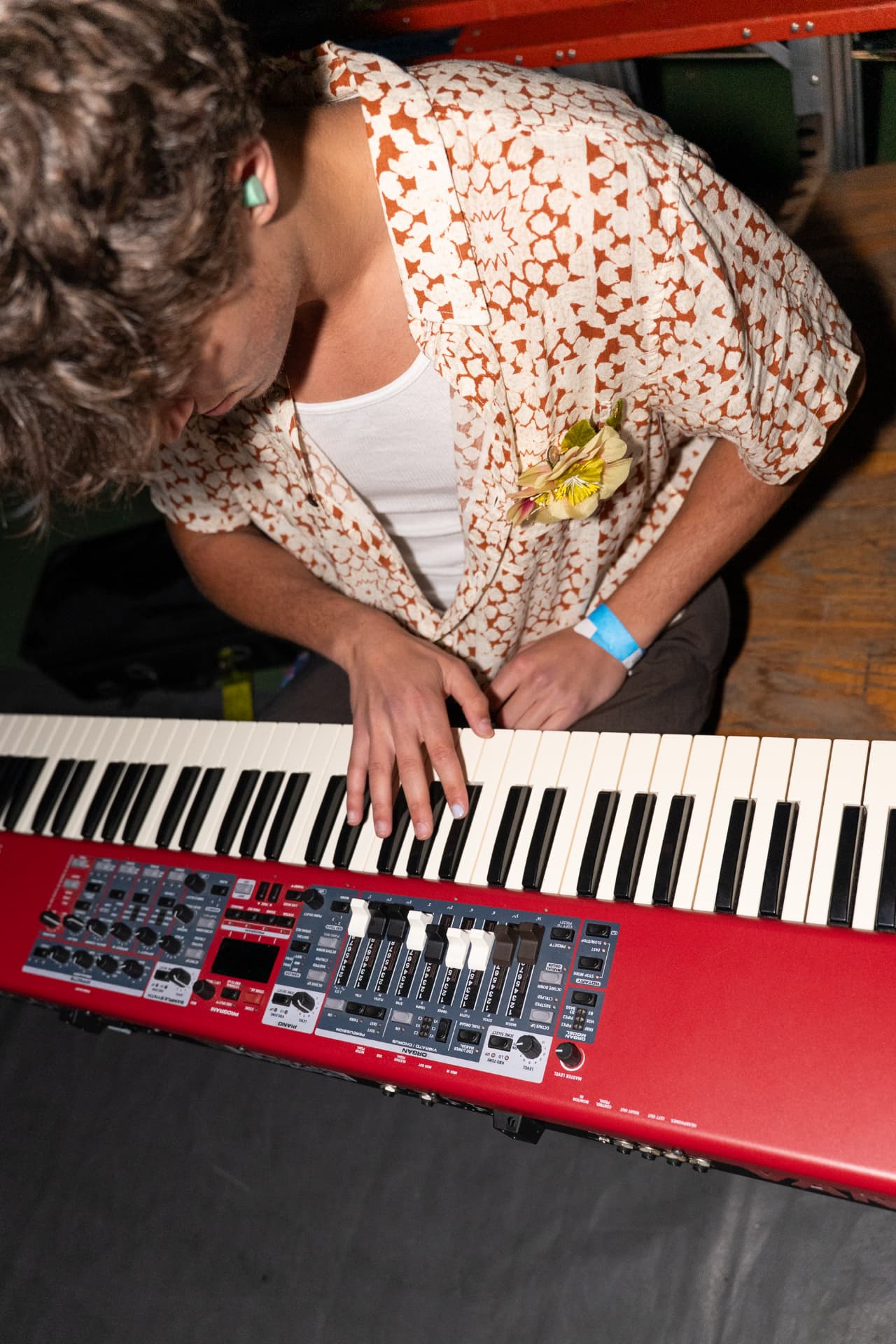 Overhead view of a keyboardist playing a Nord stage piano
